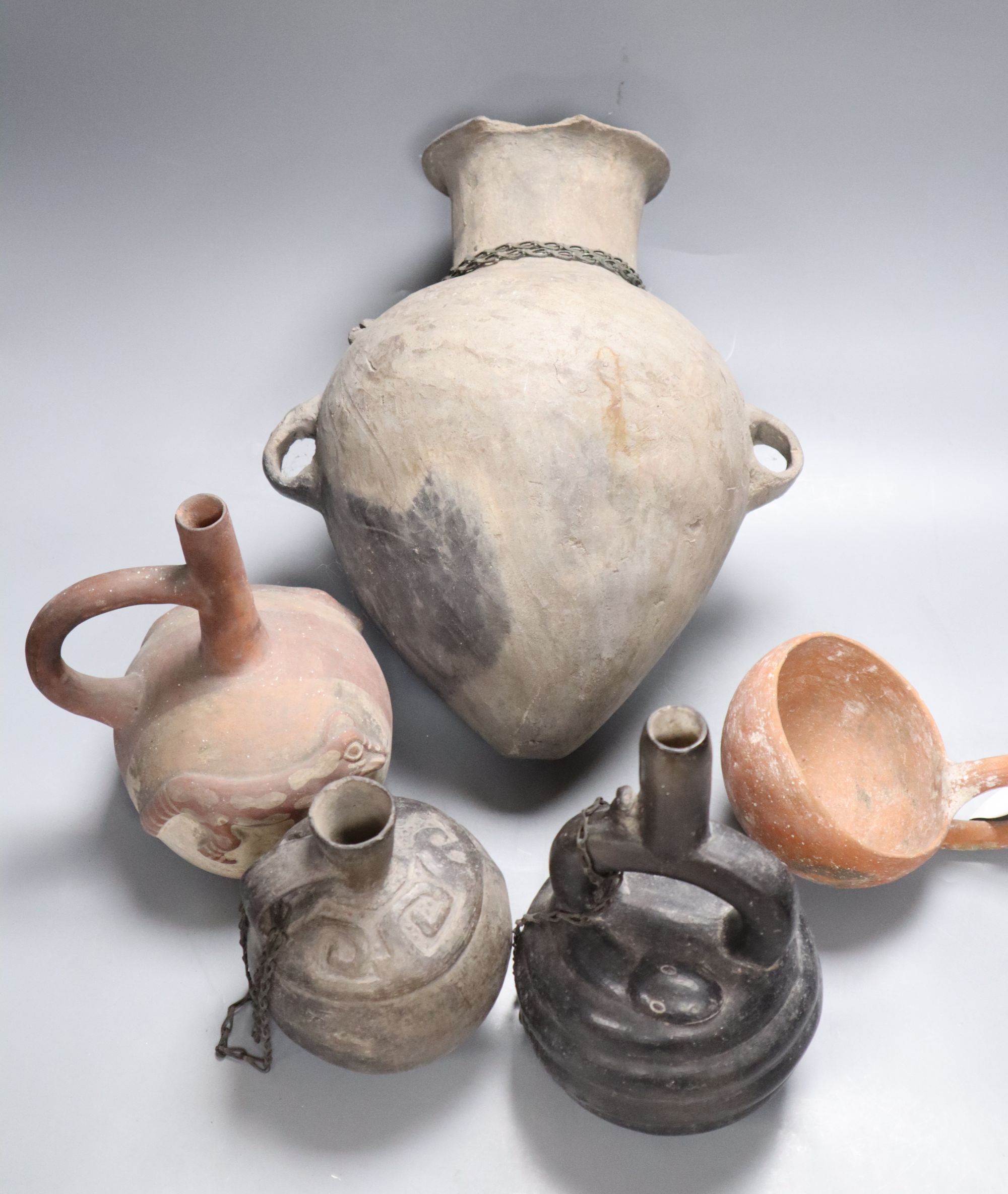 A group of five pre-Columbian or later pottery vessels